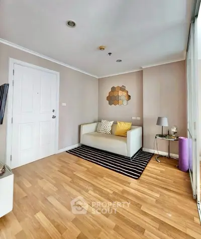 Modern living room with stylish decor and wooden flooring