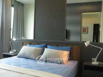 Modern bedroom with stylish decor and ample natural light