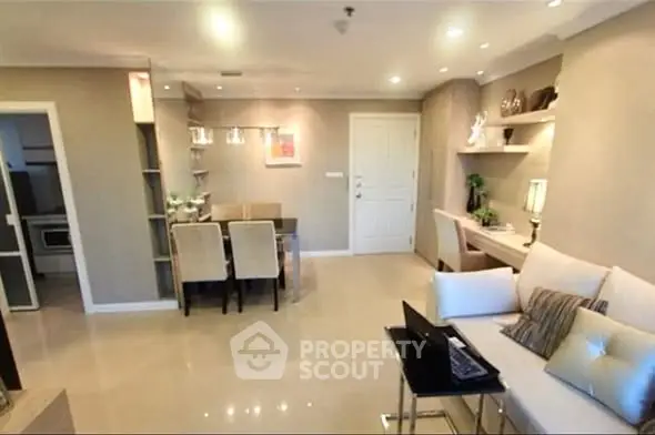 Modern living room with elegant dining area and cozy workspace