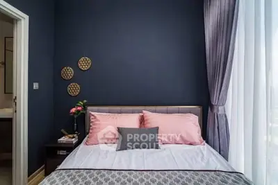 Cozy bedroom with stylish decor and natural light