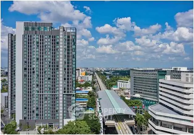 Stunning cityscape view with modern high-rise buildings and clear blue sky.