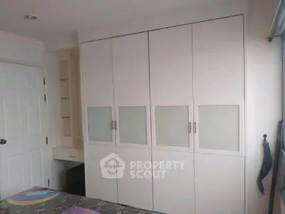 Spacious bedroom with built-in wardrobe and modern design