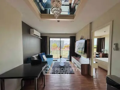 Modern living room with stylish decor and large window offering a scenic view, adjacent to a cozy bedroom.
