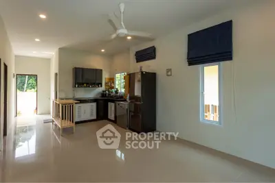 Spacious kitchen with modern appliances and open layout in a bright home interior.