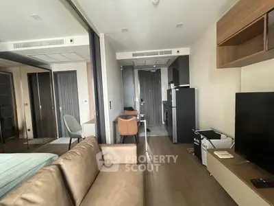 Modern studio apartment with sleek furniture and open layout, perfect for urban living.