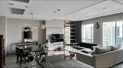 Spacious modern living room with city view, elegant furniture, and stylish lighting in a high-rise apartment.