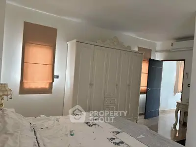 Elegant bedroom with classic wardrobe and soft lighting