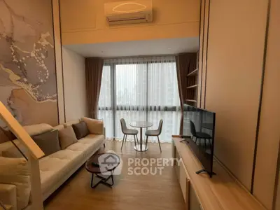 Modern living room with large window, cozy sofa, and stylish decor in high-rise apartment.