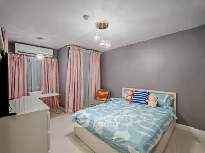 Cozy bedroom with modern decor and ample natural light, featuring stylish lighting and pastel accents.