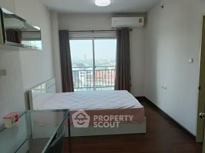 Modern bedroom with balcony view in urban apartment