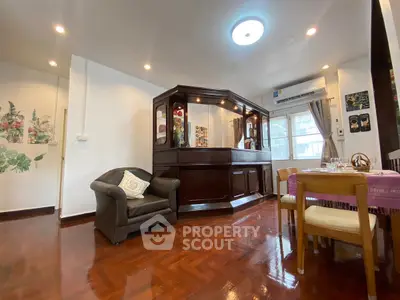 Charming living room with unique wooden bar and cozy seating area.