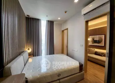 Modern bedroom with stylish decor and natural light