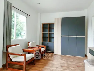 Bright and cozy living room with wooden flooring and modern furniture