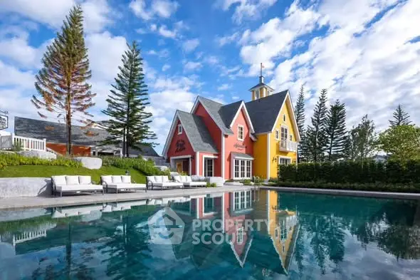 Charming colorful house with pool and lush surroundings, perfect for serene living.