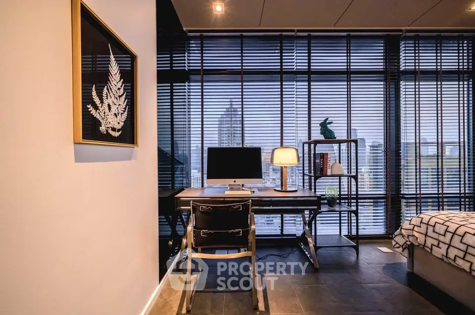 Modern study room with city view, featuring sleek desk and stylish decor.