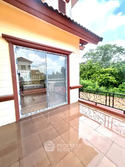 Spacious balcony with elegant railing and scenic view in a modern home