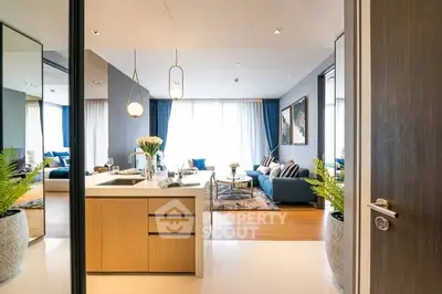 Luxurious open-layout living room with modern kitchen and elegant decor