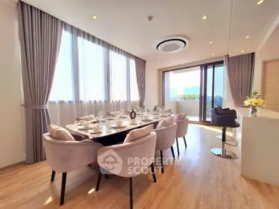 Luxurious dining area with elegant decor and large windows in a modern apartment