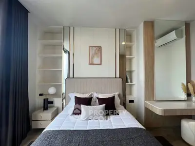 Modern bedroom with stylish decor and built-in storage, featuring a cozy bed and elegant lighting.
