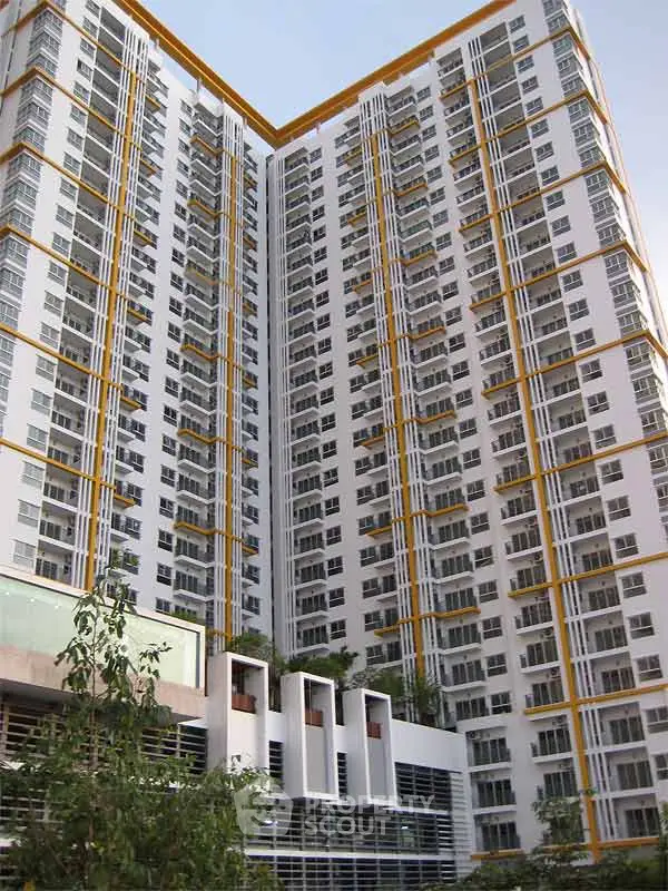 Stunning high-rise apartment building with modern architecture and expansive windows.