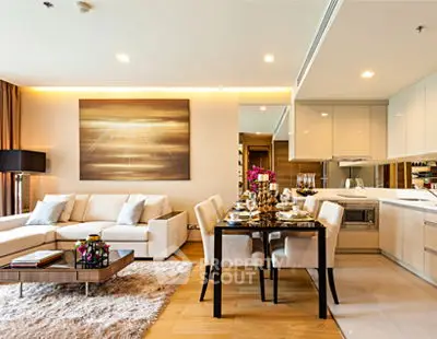 Luxurious open-plan living room and kitchen with elegant decor and modern furnishings.