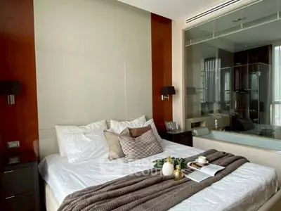 Luxurious modern bedroom with stylish decor and large window view