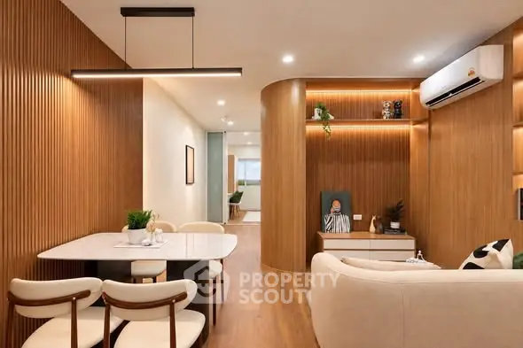 Modern living room with elegant wood paneling and stylish furniture