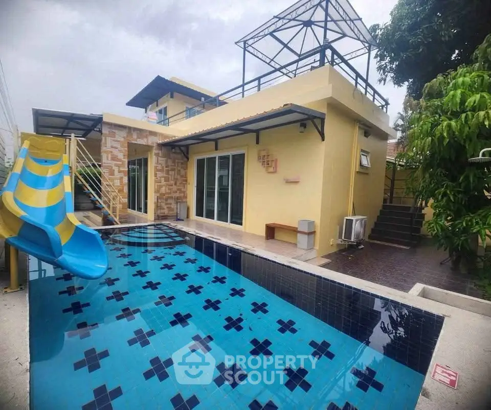 Charming villa with private pool and slide, perfect for family fun and relaxation.