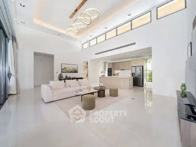 Luxurious open-plan living room with modern kitchen and elegant lighting