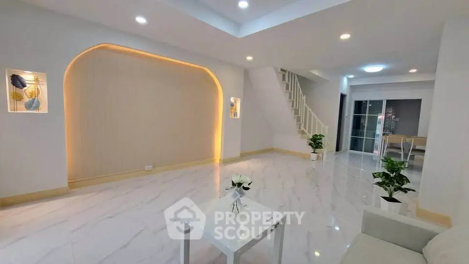 Spacious modern living room with elegant lighting and marble flooring