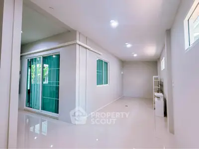 Spacious modern interior with sleek design and large windows for natural light.