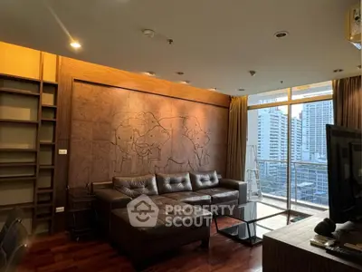 Luxurious living room with modern decor and city view balcony
