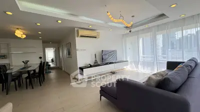 Spacious modern living room with elegant decor and city view balcony