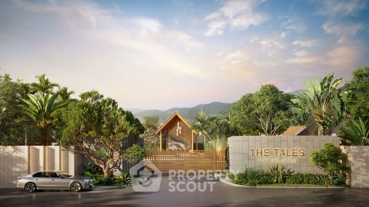 Luxurious gated entrance of The Tales with lush greenery and scenic mountain views.