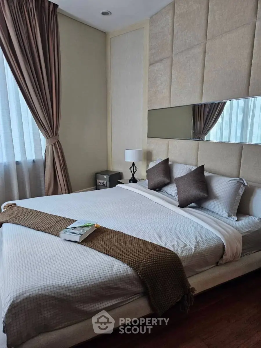 Luxurious bedroom with elegant decor and plush bedding in modern apartment