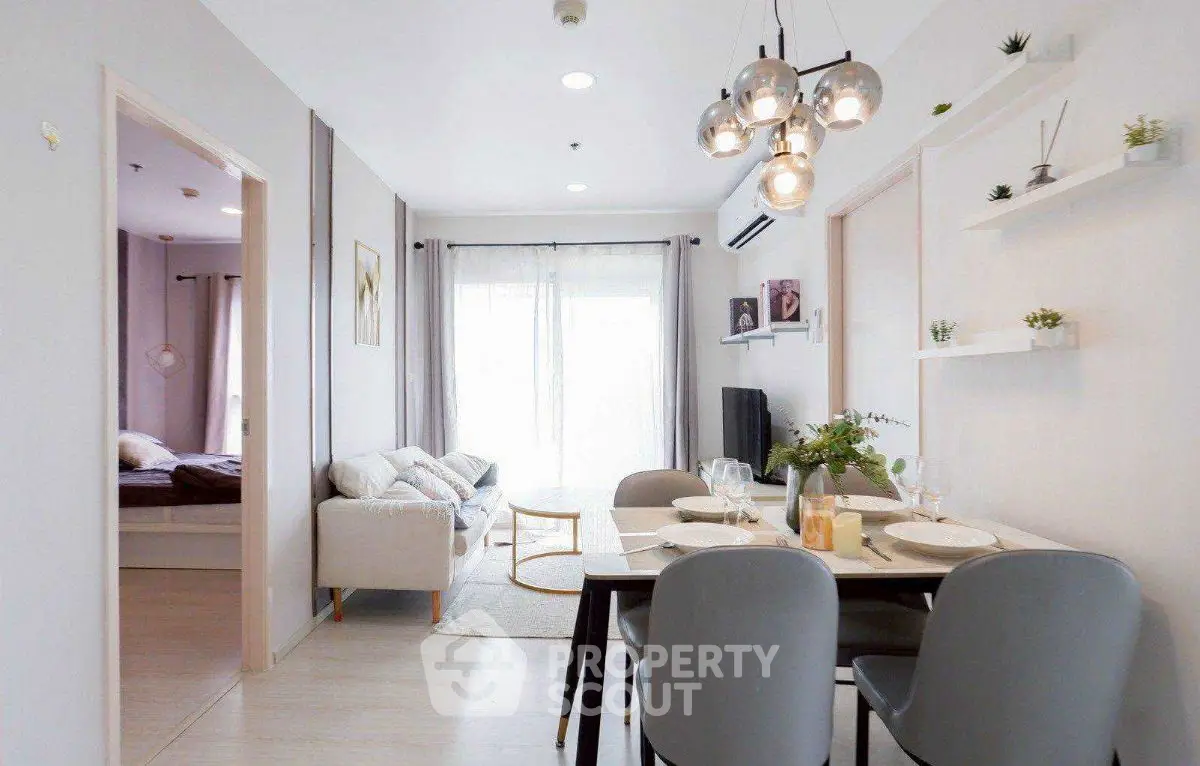 Modern open-plan living and dining area with stylish decor and natural light.