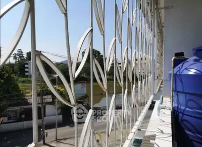 Modern balcony with unique metal railing design and scenic view