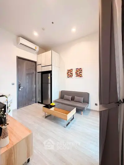 Modern living room with sleek furniture and stylish decor in a contemporary apartment.