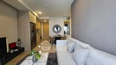 Modern living room with open kitchen and stylish decor