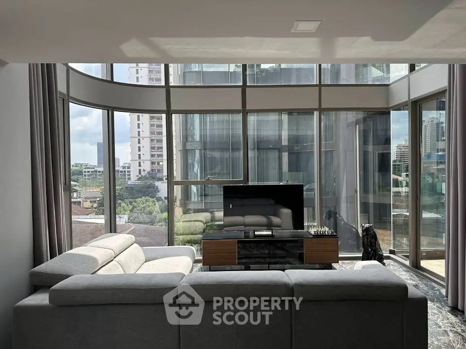 Luxurious living room with panoramic city views and modern decor