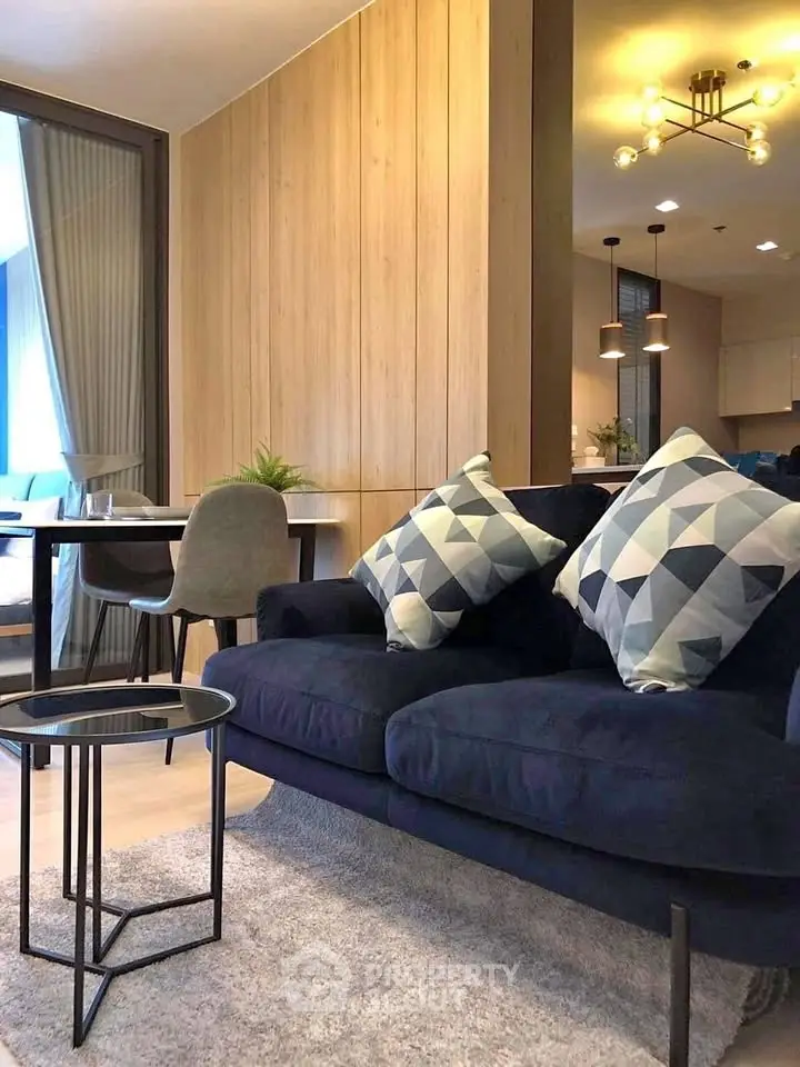 Modern living room with stylish decor and cozy seating in a contemporary apartment.