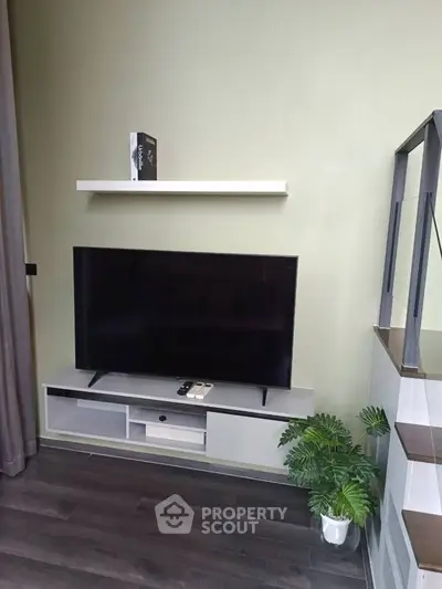 Modern living room with sleek TV setup and stylish decor