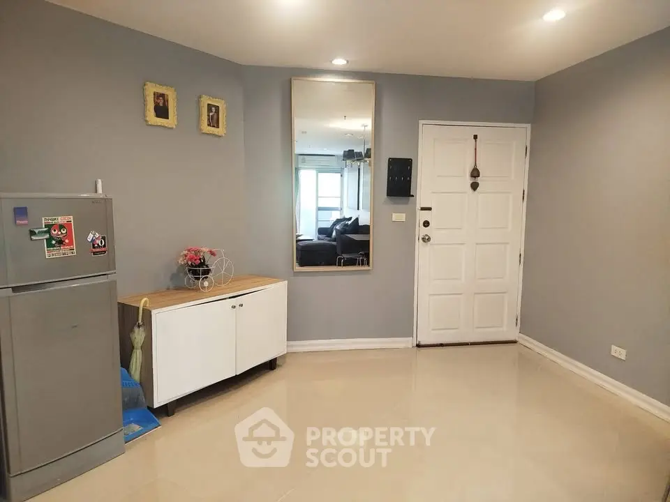 Modern apartment entrance with sleek decor and spacious layout