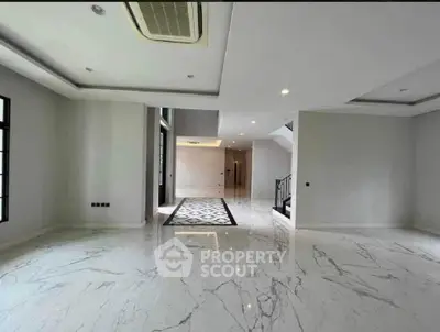 Spacious modern living room with marble flooring and elegant design