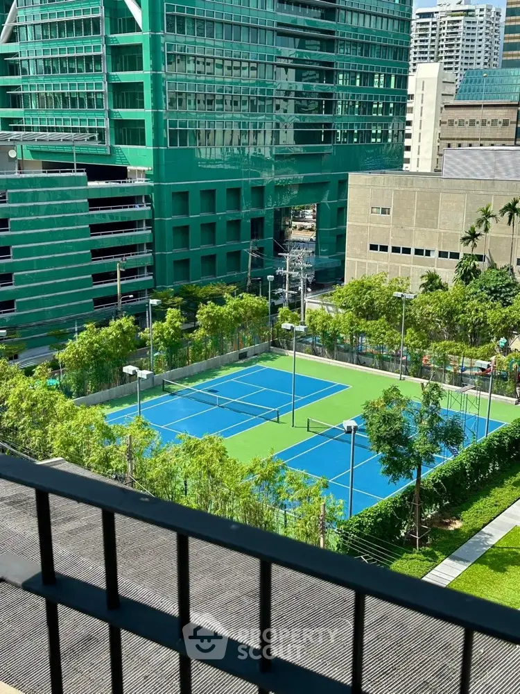 Stunning urban view with tennis courts and modern architecture, perfect for active lifestyle seekers.