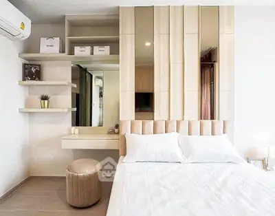 Modern bedroom with stylish decor, built-in shelves, and cozy ambiance in a contemporary apartment.