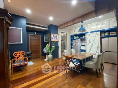 Stylish dining area with modern kitchen and elegant decor