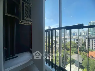 Stunning city view from a modern apartment balcony with sleek railing design.