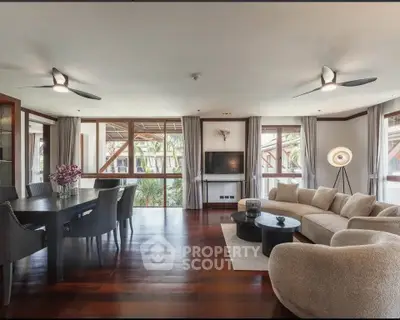 Spacious modern living room with elegant furniture and large windows