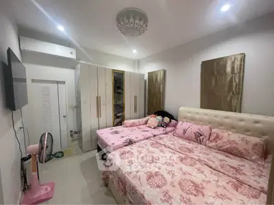 Cozy bedroom with elegant decor and ample storage space